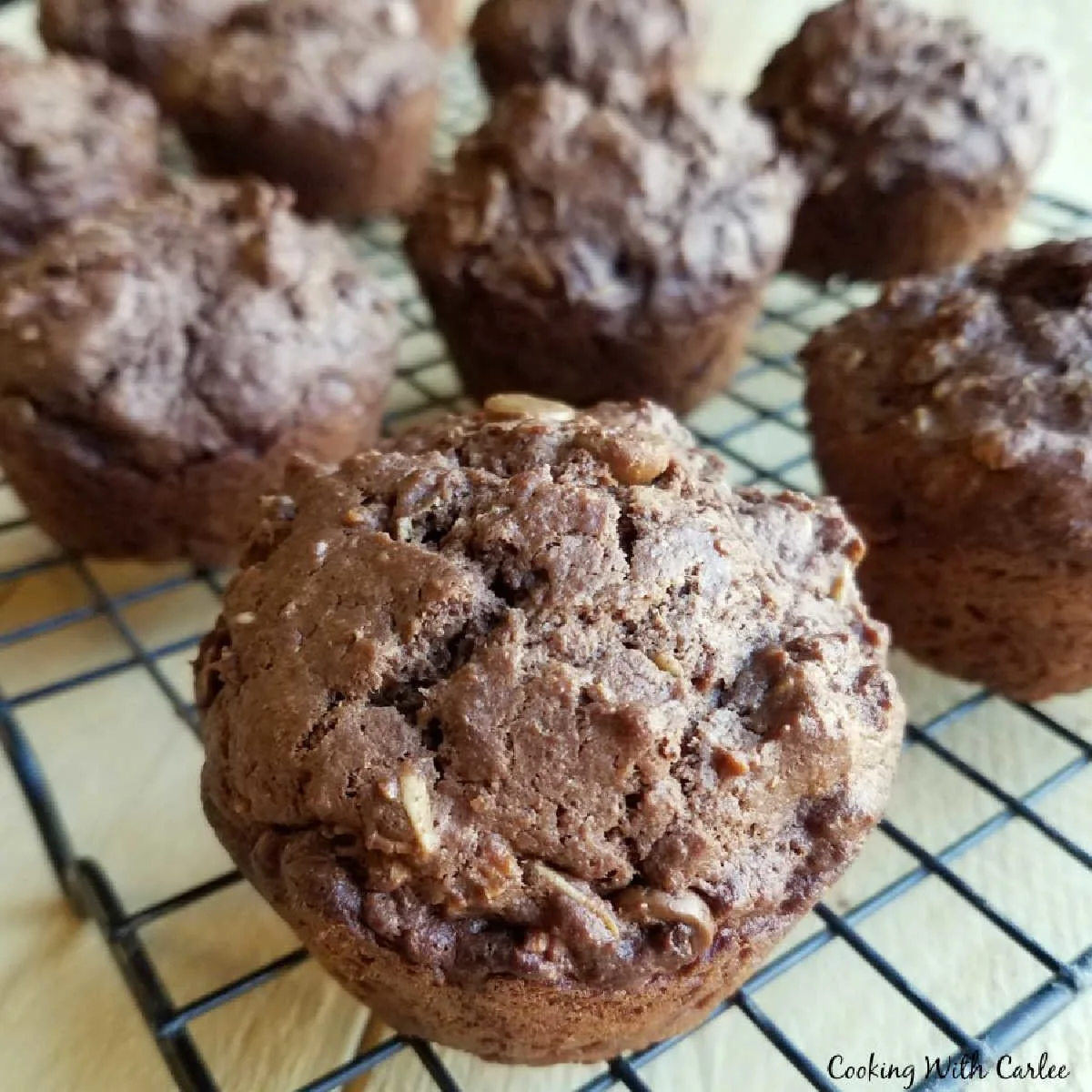 chocolate peanut butter sourdough muffins in wire cooling rack.