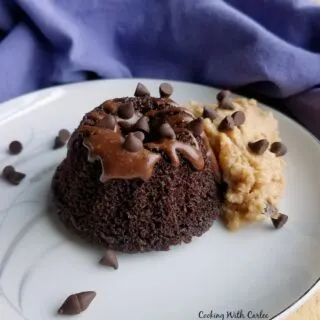 mini chocolate bundt cake with chocolate drizzle, mini chocolate chips and peanut butter whipped cream.