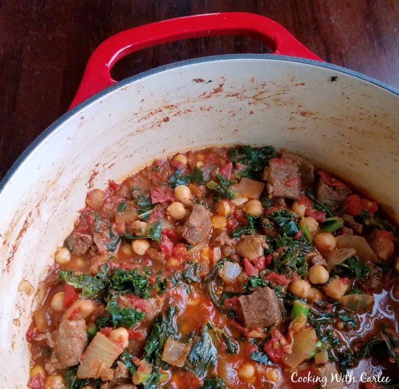 pot with stew made from lamb, tomatoes, kale, chickpeas etc. 