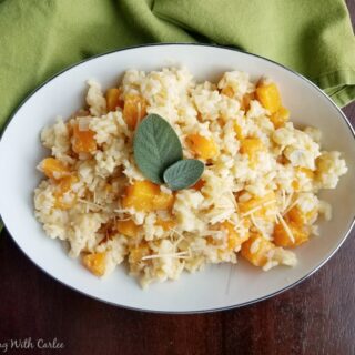 bowl of creamy risotto with cubes of butternut squash.