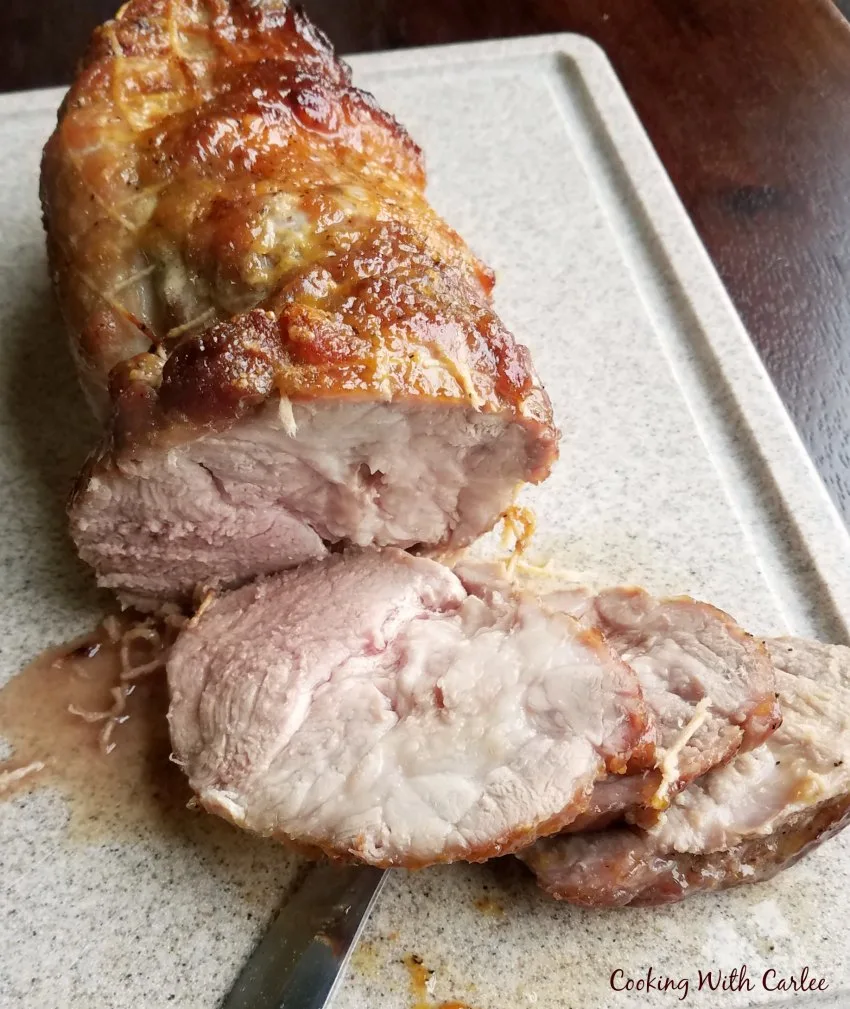 slices of pork roast on cutting board
