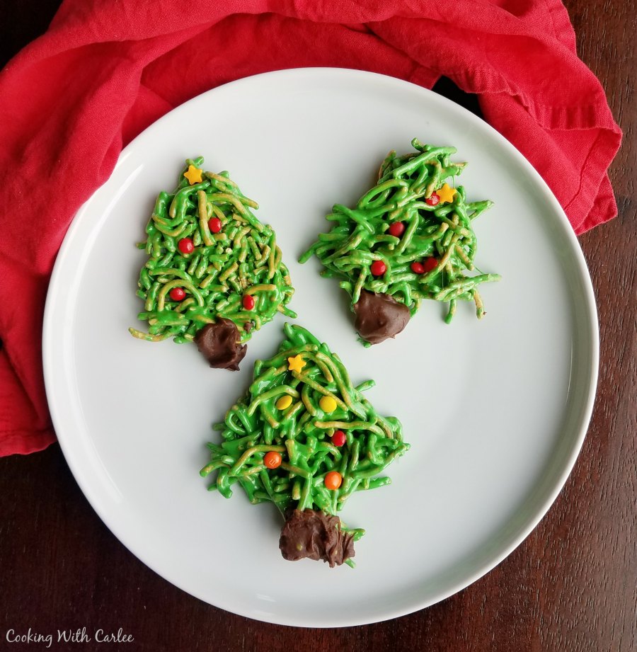plate with several Christmas tree cookies ready to eat.