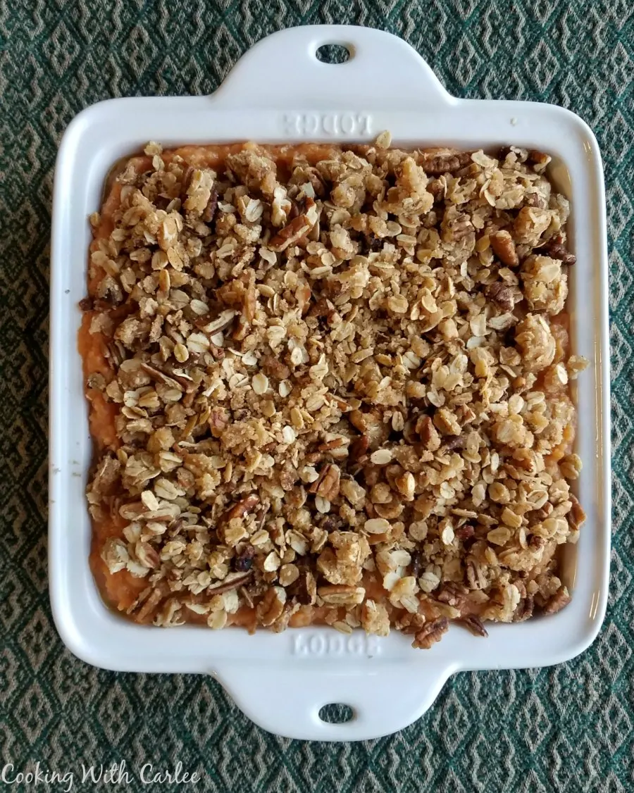 square casserole dish pile high with oatmeal and pecan crunch topping showing.