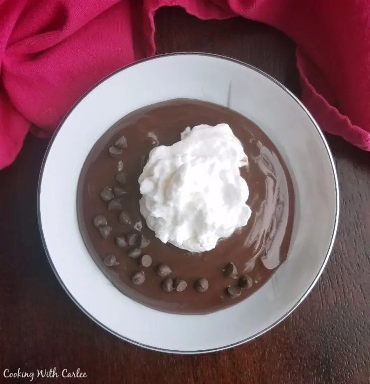 bowl of chocolate pudding with whipped cream