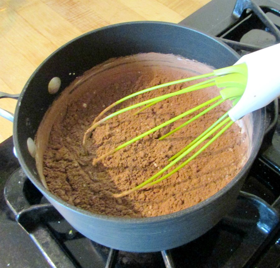 sauce pan with dry ingredients for homemade chocolate pudding inside.