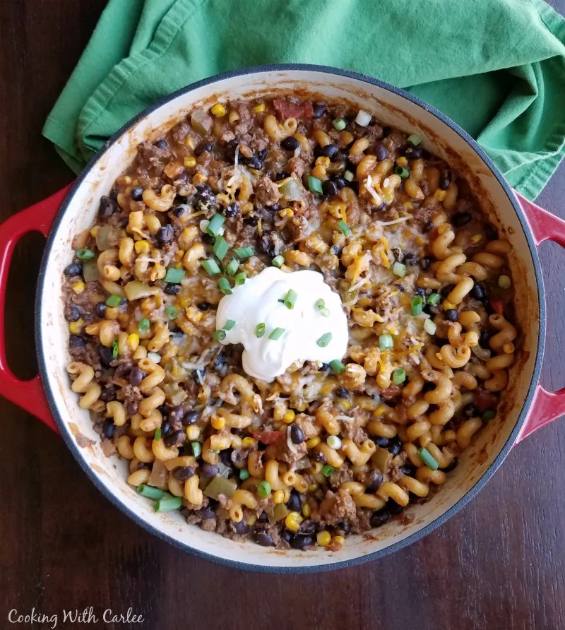 Skillet filled with pasta, taco meat, corn, beans and more.