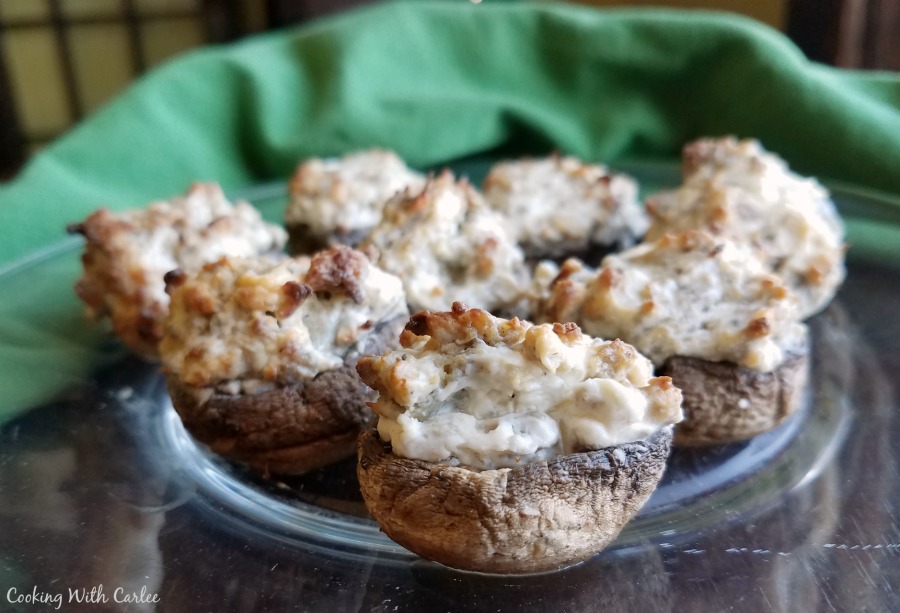 plate of sausage and cream cheese stuffed mushrooms.