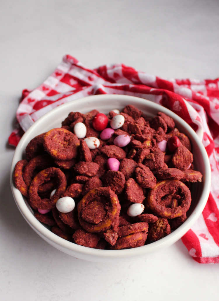 bowl of red velvet puppy chow ready for snacking