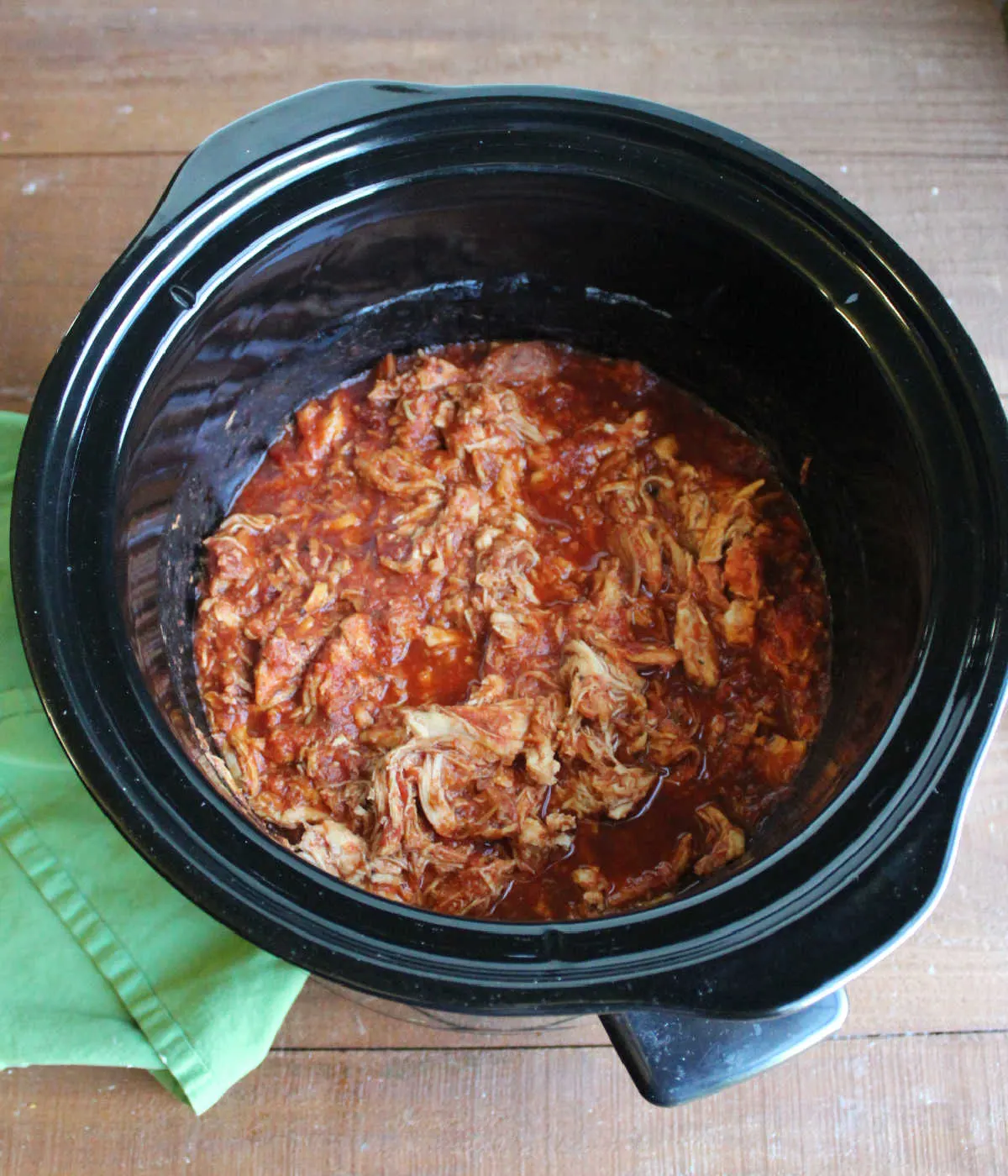 Shredded chicken and marinara in slow cooker ready to be made into sandwiches.