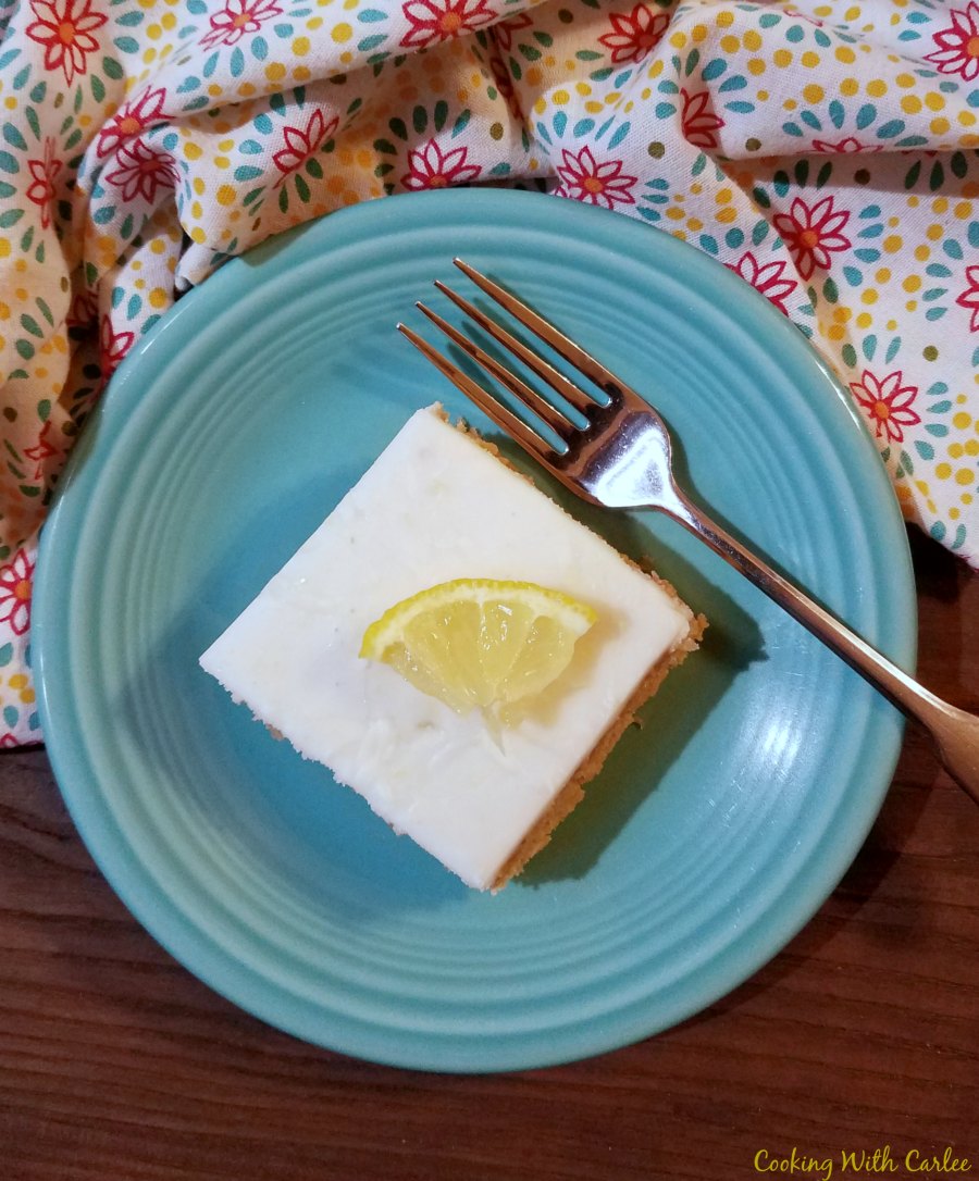 slice of arnold palmer cake with wedge of lemon on top.