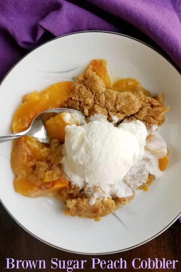  Sometimes you just need a little peach cobbler. A la mode, of course! There is just something comforting and delicious about the warm fruit and simple topping with a bit of melted vanilla ice cream seeping into it. This recipe takes the cozy to the next level with a bit of cinnamon and brown sugar.  It smells great baking and tastes even better. 