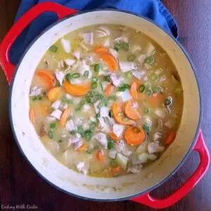 pot filled with easy chicken stew loaded with chunks of carrots and potatoes.