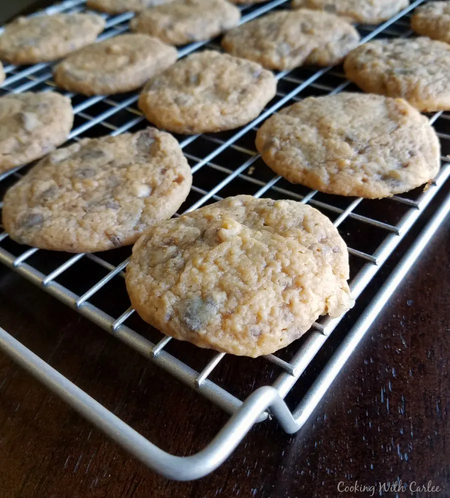 Butterscotch toffee cookies cooling on wire rack.