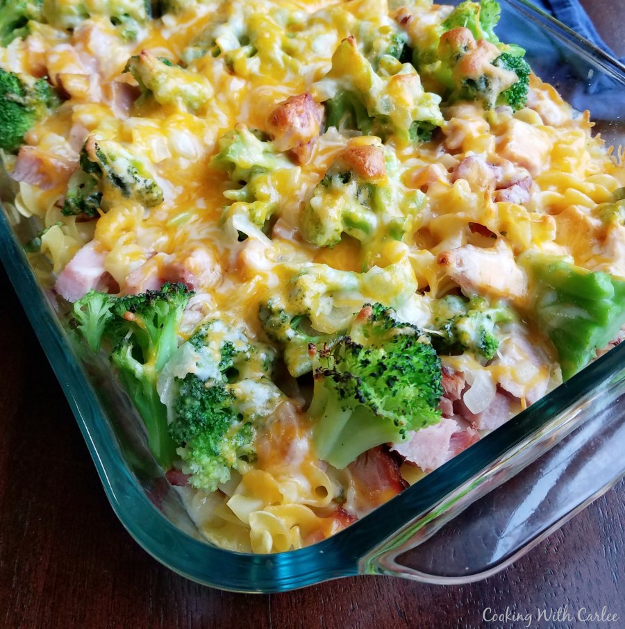 casserole dish filled with pasta, broccoli, cheese and ham fresh from oven