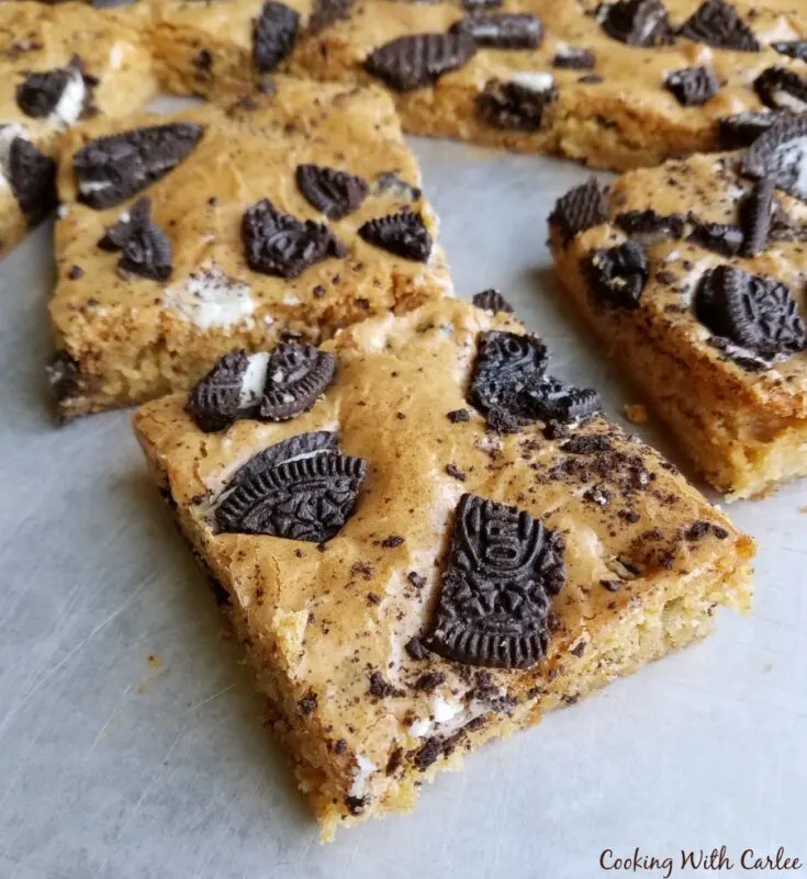 pieces of cookies and cream blondie cut and ready to eat.