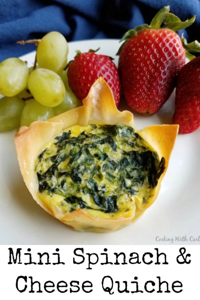 Tiny little quiche are filled with spinach and cheese for a couple bite of brunch goodness. They are perfect for making ahead and heating and eating later!