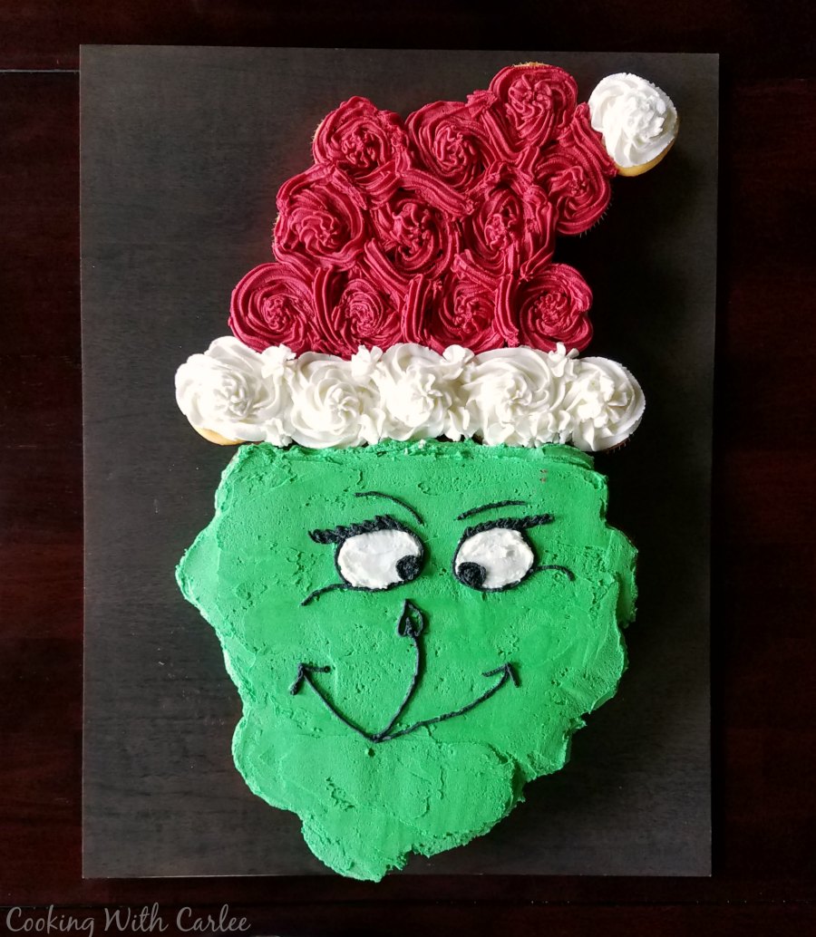 Grinch cupcake pull-apart cake with Santa hat for Dr. Seuss party.