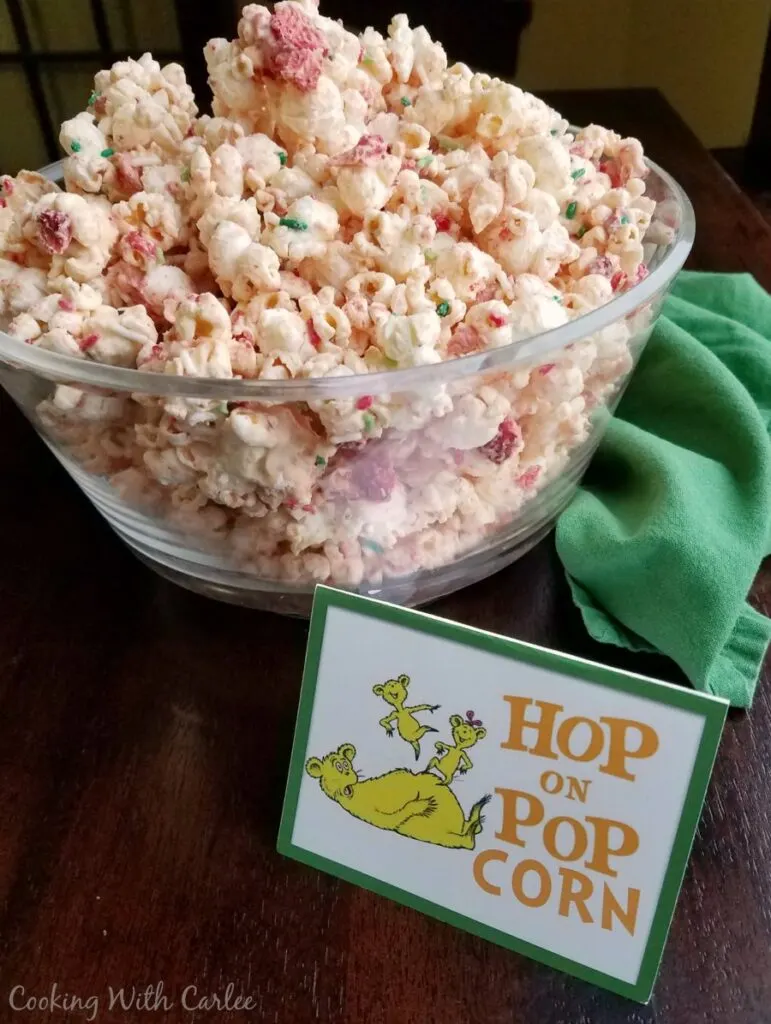 Big bowl filled with strawberries and cream popcorn with hop on popcorn.