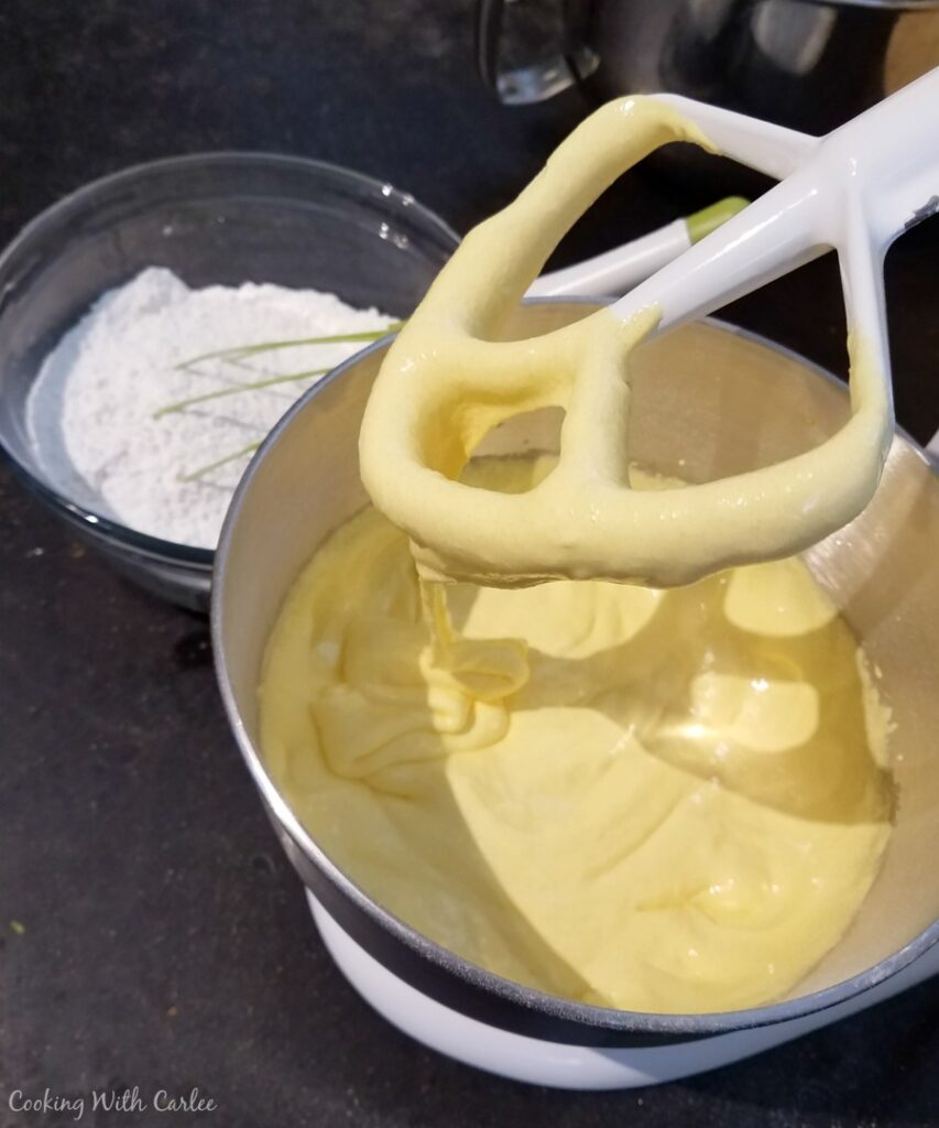 creamy whipped egg yolks and sugar mixture in mixer bowl