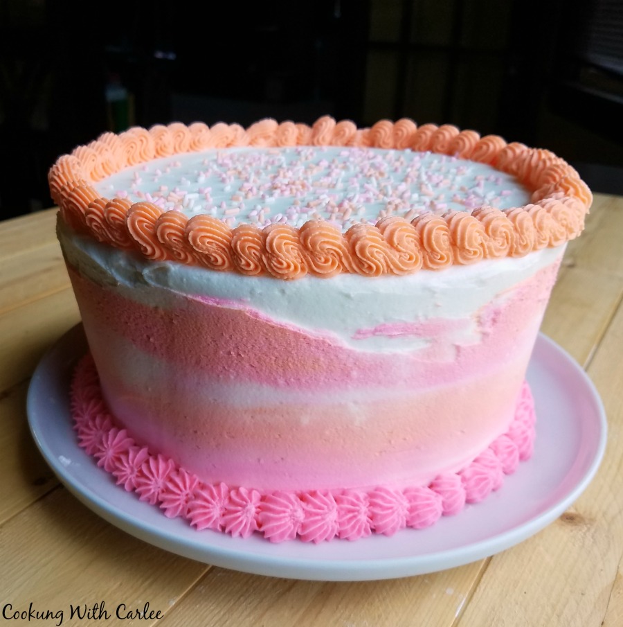 whole cake that looks like regular birthday cake with pink and orange frosting, but it's really giant cookies inside