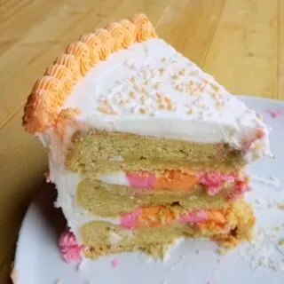 large slice of layered cookie birthday cake.