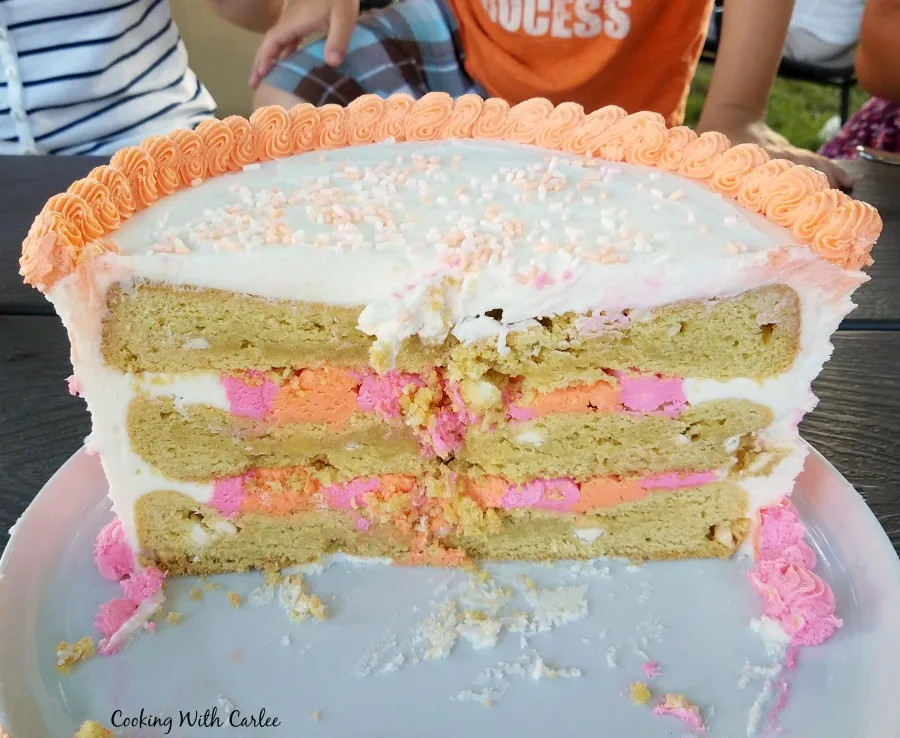 showing the inside of the cookie cake with layers of large cookies and frosting.