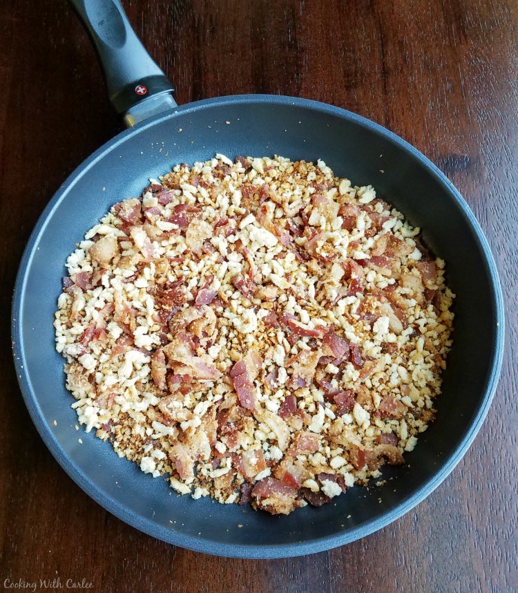 swiss diamond skillet with bacon and bread crumbs in it.