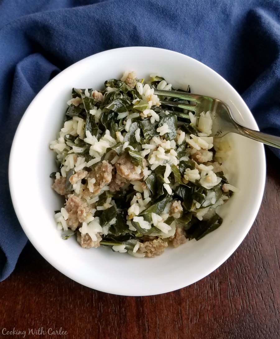 bowl of one pot collards with rice and sausage.