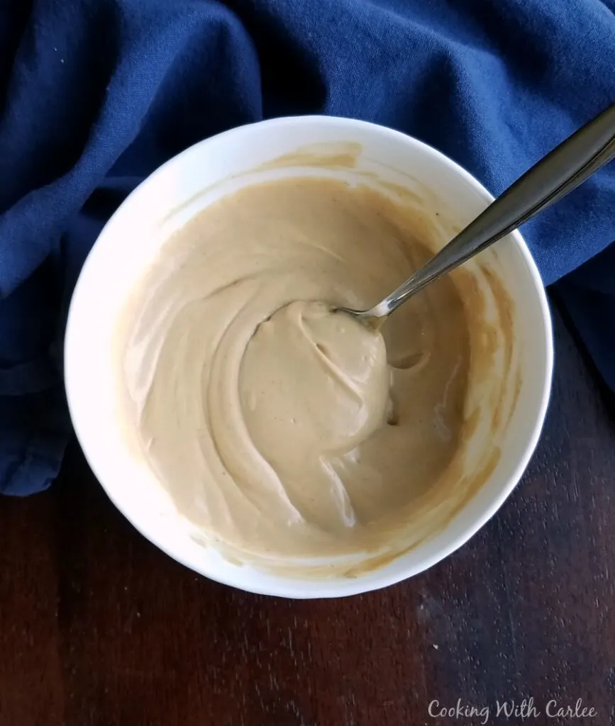 bowl of creamy peanut yogurt salad dressing
