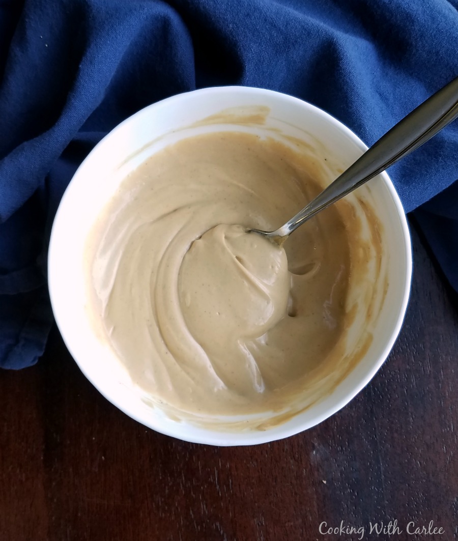 bowl of creamy peanut yogurt salad dressing