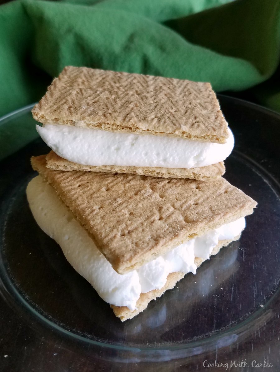 stack of two toasted marshmallow frosting and graham cracker sandwiches