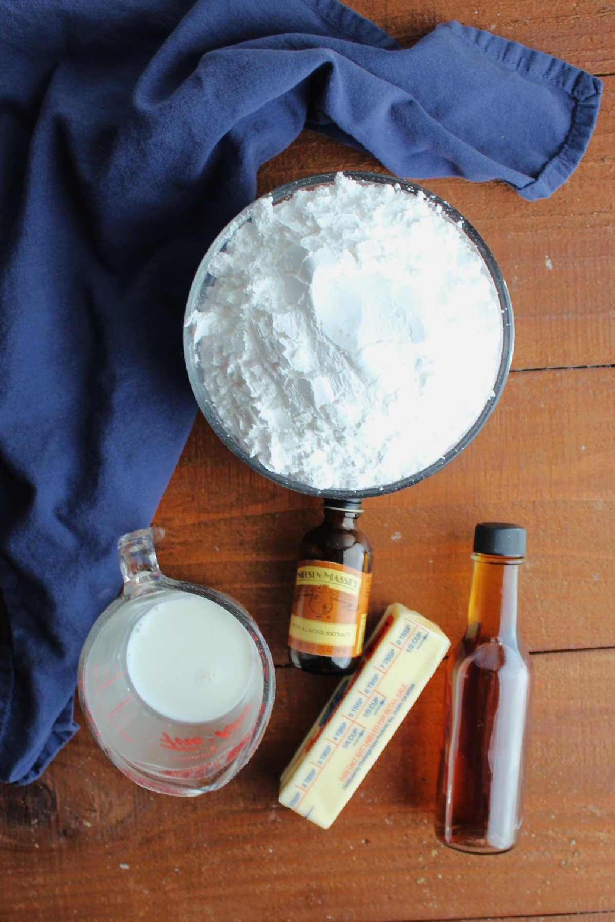 Vanilla icing ingredients including powdered sugar, milk, butter, vanilla, and almond extract.