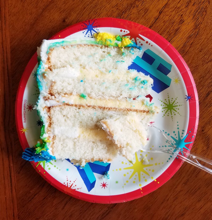first bite of birthday cake on fork.