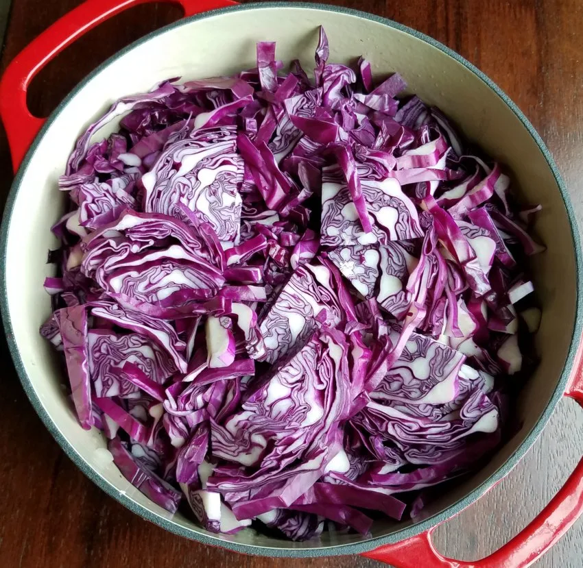 dutch oven full of sliced red cabbage