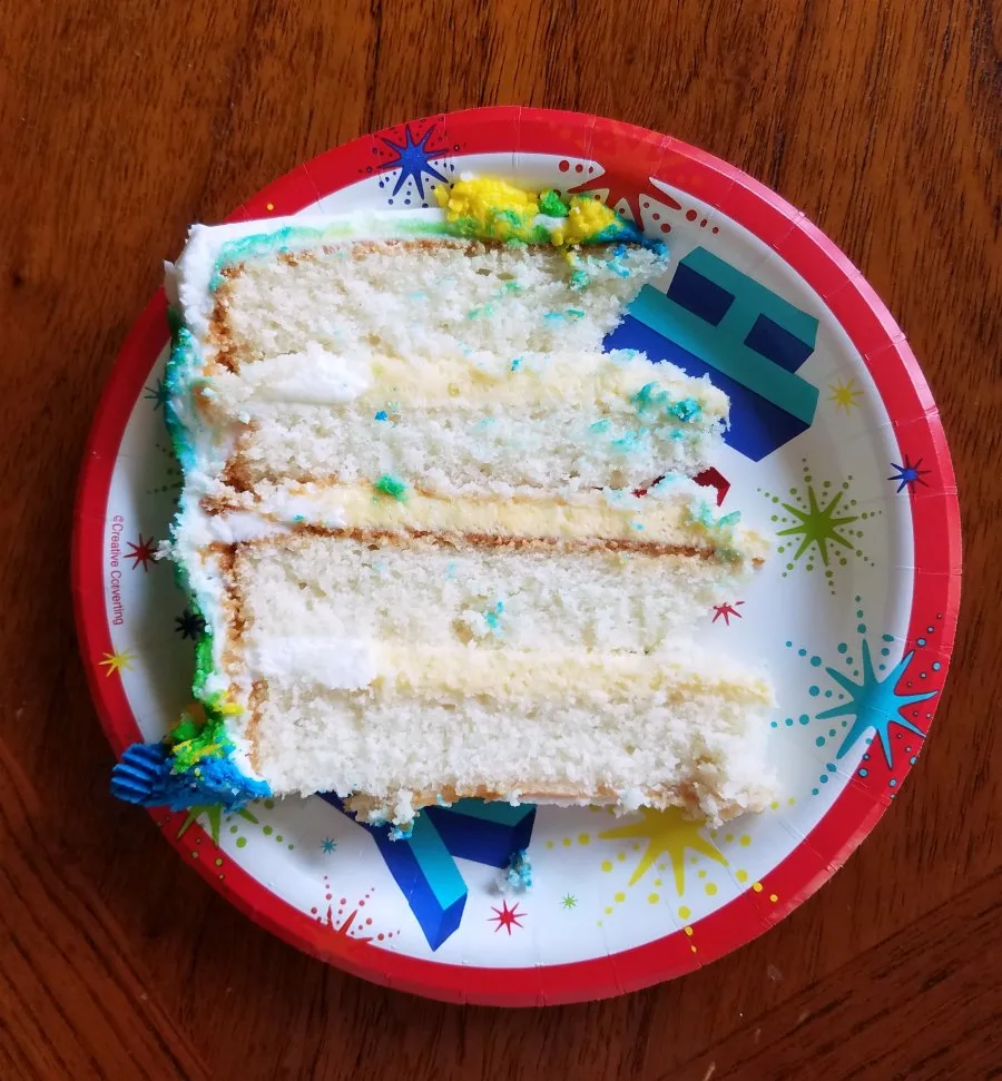 slice of layered white cake with vanilla pudding filling.