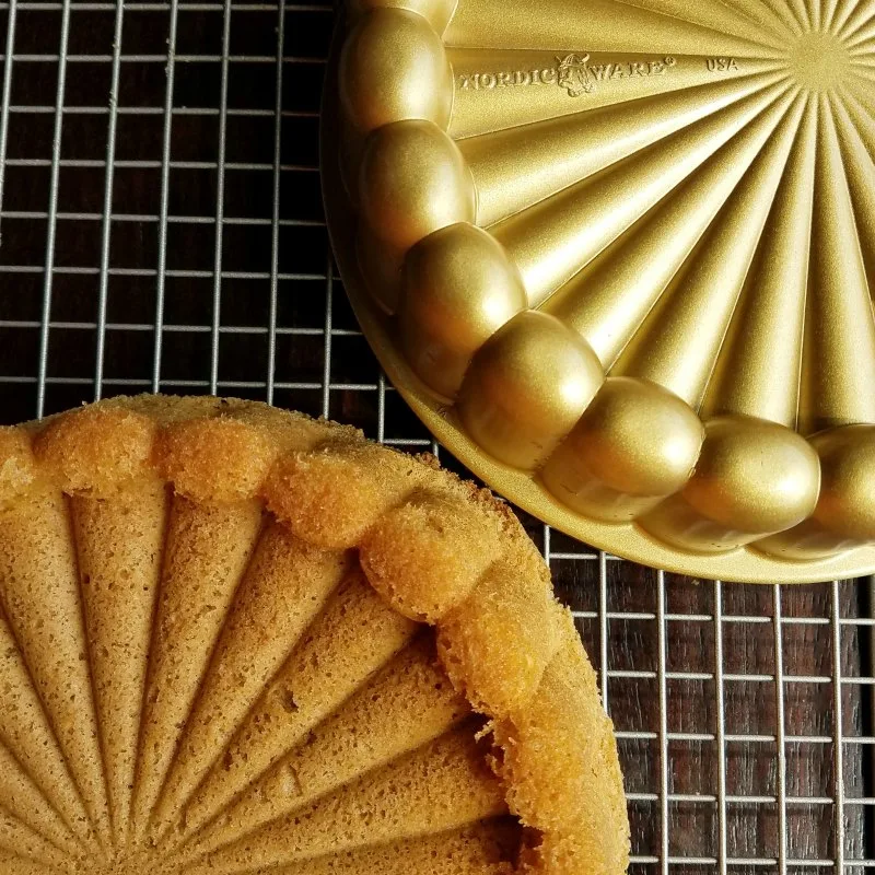 cinnamon sponge turned out of gold nordic ware charlotte shaped cake pan.