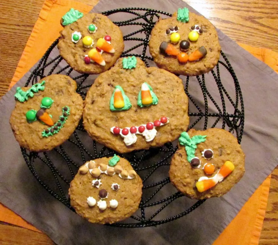 jack-o-lantern cookies on spider web tray.