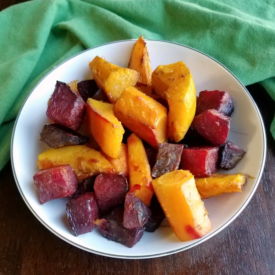 bowl of chinese 5 spice roasted carrots, beets and squash.