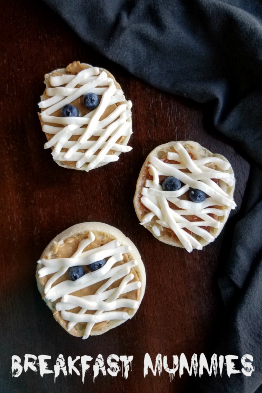 These super simple English muffin mummies are ready to spook your breakfast table. They are an eerily good Halloween snack as well. Whip them up in a couple minutes and cackle in delight.