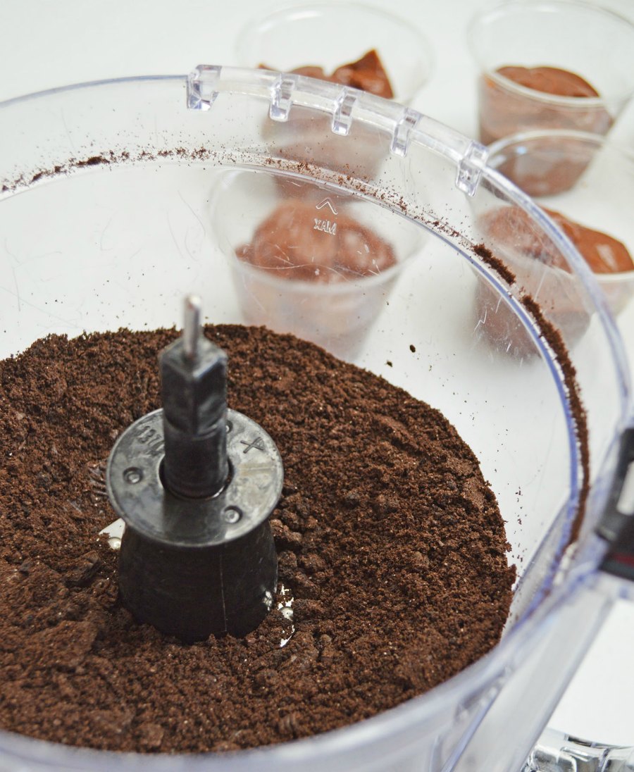 food processor with chocolate  cookie crumbs in it for edible "dirt" 