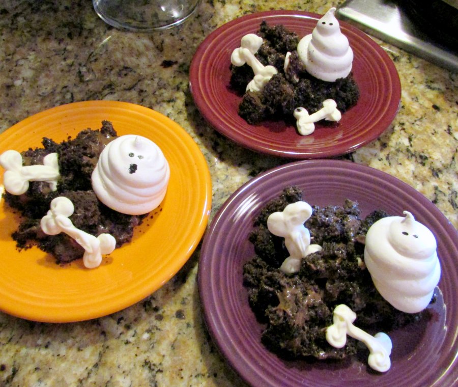 3 dessert plates served with bones, chocolate dirt and meringue ghosts.
