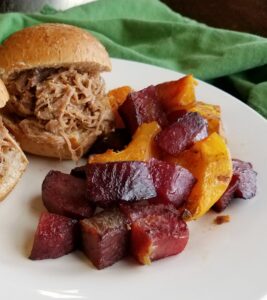 Chinese 5 spice roasted veggies on plate with Hula pork sliders.
