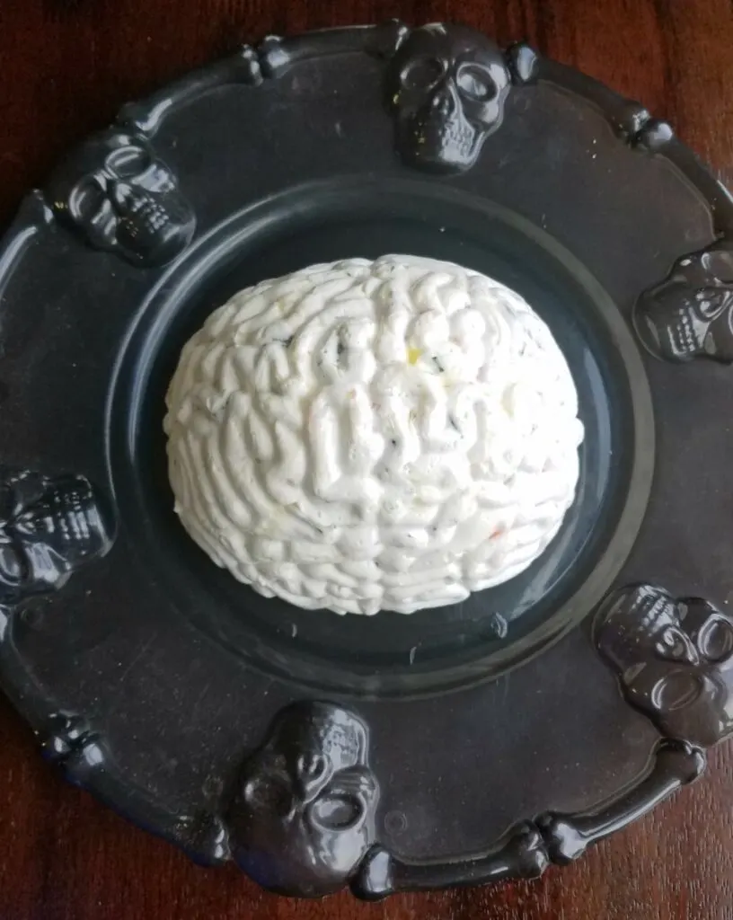 brain shaped shrimp spread on black skull platter