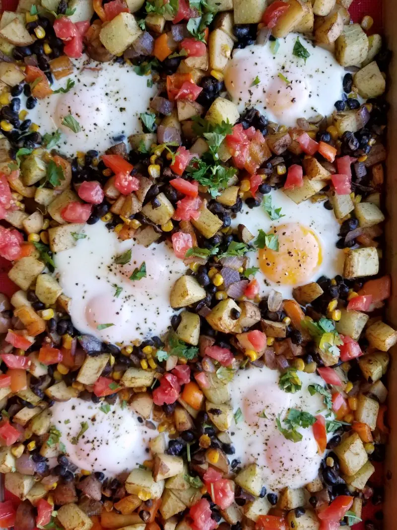 eggs baked on sheet pan with diced vegetables, beans etc. Ready to serve.