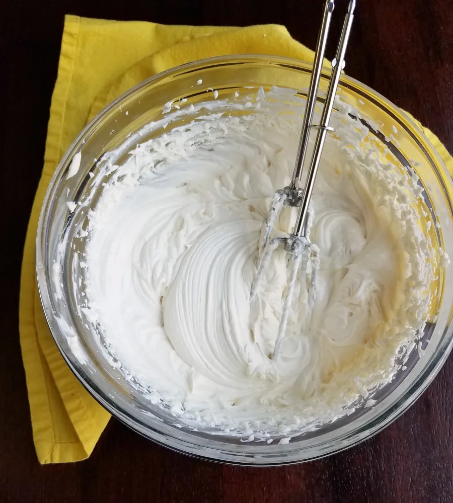 lemon sweetened condensed milk frosting with no powdered sugar in bowl.