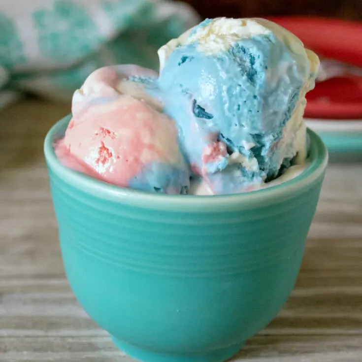 blue mug filled with red white and blue ice cream