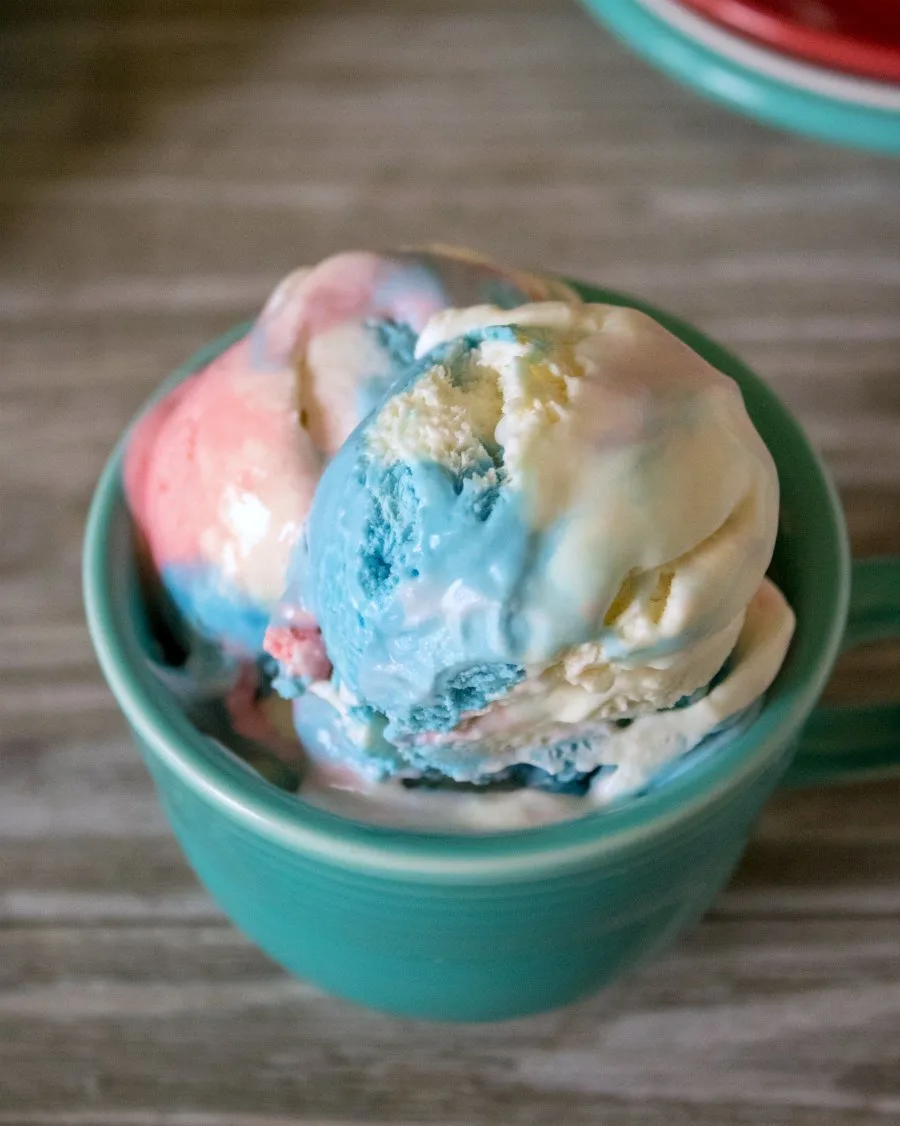 bowl of red white and blue ice cream ready to eat.