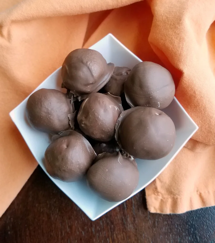 bowl of chocolate coated truffles.