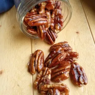 bowl of pecans with crunchy caramel coating.
