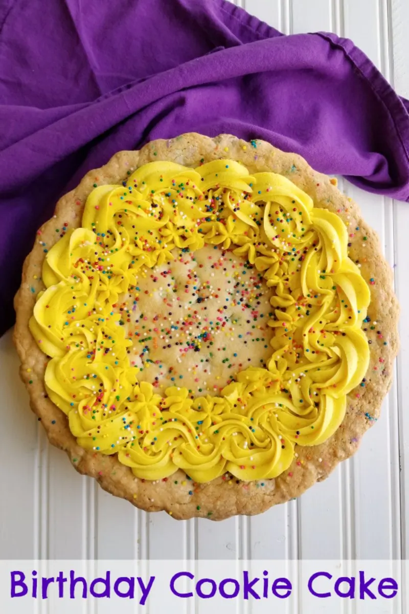 A supersized chewy vanilla cookie filled with plenty of festive sprinkles and white chocolate chips and topped with frosting and more sprinkles. This cookie cake is what birthday dreams are made of.